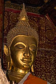 Wat Xieng Thong temple in Luang Prabang, Laos.  Detail of the main Buddha statue inside the 'sim'. 